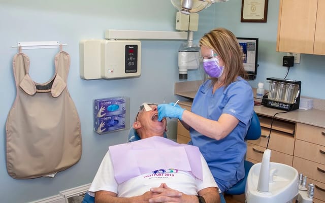 A treatment room at Radiant Smiles, looking across the chair to the cabinetry.